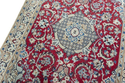 Backside of handmade 2000s Nain rug showing knot structure and weave density