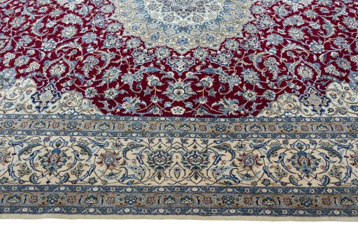 Corner detail of 2000s Nain rug showing border pattern and Wool pile
