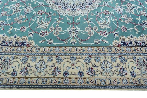 Corner detail of 1970s Nain rug showing border pattern and Wool pile