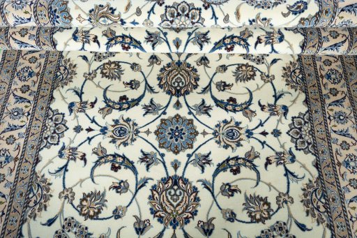 Corner detail of 1970s Nain rug showing border pattern and Wool pile