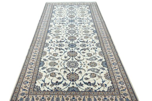 Surface texture of 1970s Nain rug with natural Wool and intricate pattern