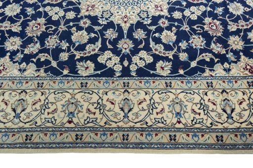 Corner detail of 1970s Nain rug showing border pattern and Wool pile
