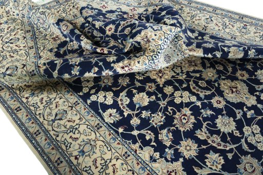 Surface texture of 1970s Nain rug with natural Wool and intricate pattern