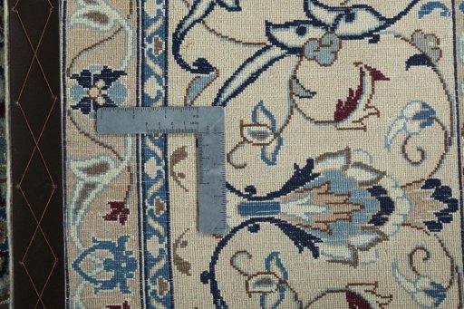 Backside of handmade 1970s Nain rug showing knot structure and weave density