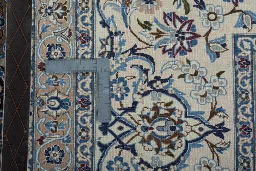 Backside of handmade 1970s Nain rug showing knot structure and weave density