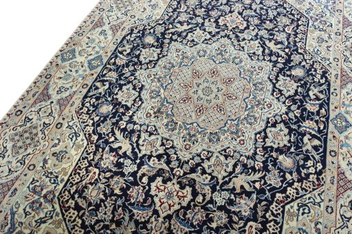 Backside of handmade 1970s Nain rug showing knot structure and weave density