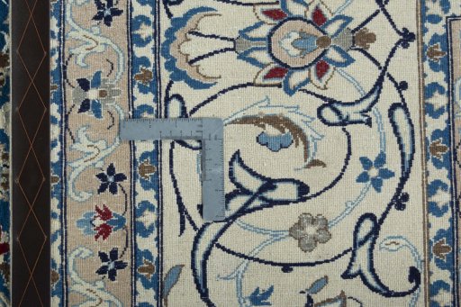 Backside of handmade 1970s Nain rug showing knot structure and weave density
