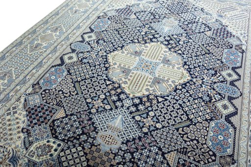 Backside of handmade 1970s Nain rug showing knot structure and weave density