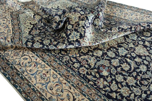 Surface texture of 2000s Nain rug with natural Wool and intricate pattern