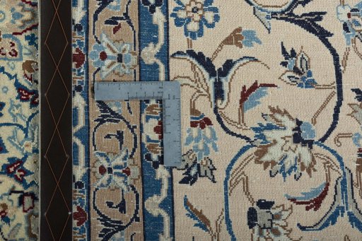 Backside of handmade 2000s Nain rug showing knot structure and weave density