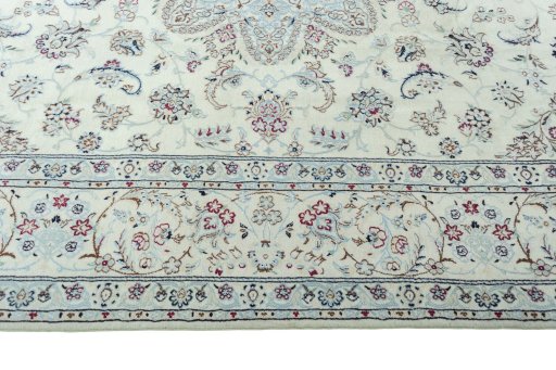 Corner detail of 2000s Nain rug showing border pattern and Wool pile