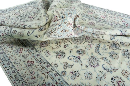 Surface texture of 2000s Nain rug with natural Wool and intricate pattern