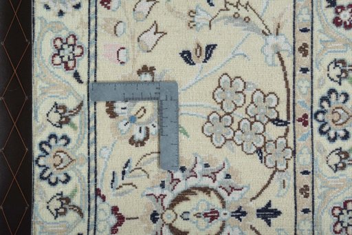 Backside of handmade 2000s Nain rug showing knot structure and weave density