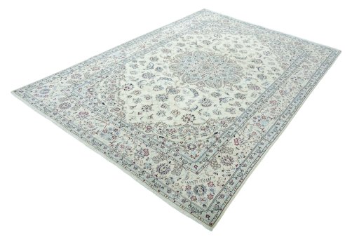Corner detail of 2000s Nain rug showing border pattern and Wool pile