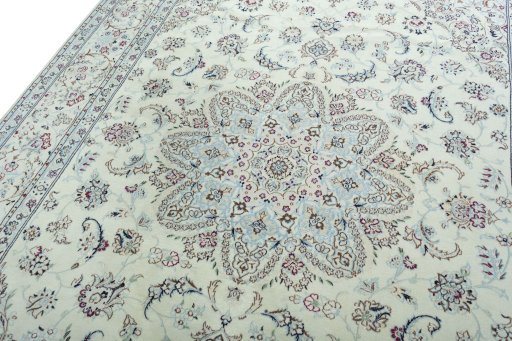Backside of handmade 2000s Nain rug showing knot structure and weave density