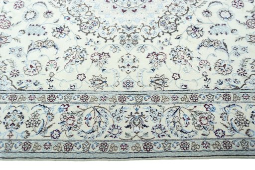 Corner detail of 2000s Nain rug showing border pattern and Wool pile