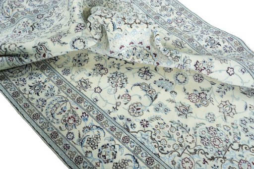 Surface texture of 2000s Nain rug with natural Wool and intricate pattern