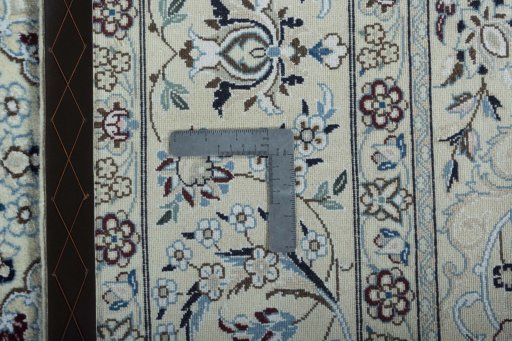 Backside of handmade 2000s Nain rug showing knot structure and weave density