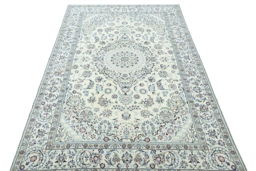 Surface texture of 2000s Nain rug with natural Wool and intricate pattern