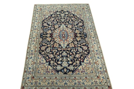 Surface texture of 2000s Nain rug with natural Wool and intricate pattern