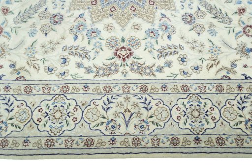 Corner detail of 2000s Nain rug showing border pattern and Wool pile