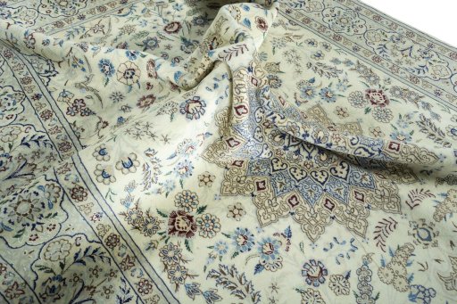 Surface texture of 2000s Nain rug with natural Wool and intricate pattern