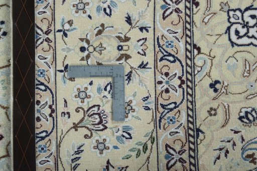 Backside of handmade 2000s Nain rug showing knot structure and weave density