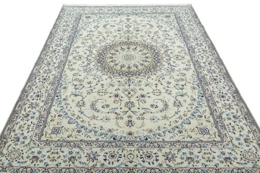 Surface texture of 2000s Nain rug with natural Wool and intricate pattern