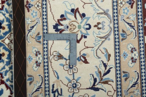 Backside of handmade New Nain rug showing knot structure and weave density