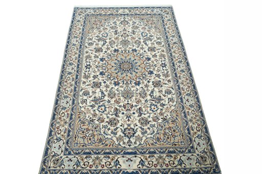Surface texture of 2000s Nain rug with natural Wool and intricate pattern