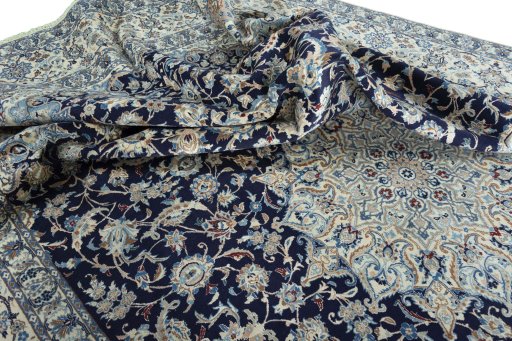 Surface texture of 2000s Nain rug with natural Wool and intricate pattern