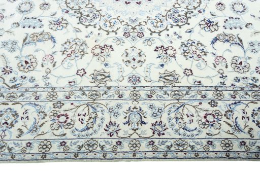 Corner detail of 2000s Nain rug showing border pattern and Wool pile