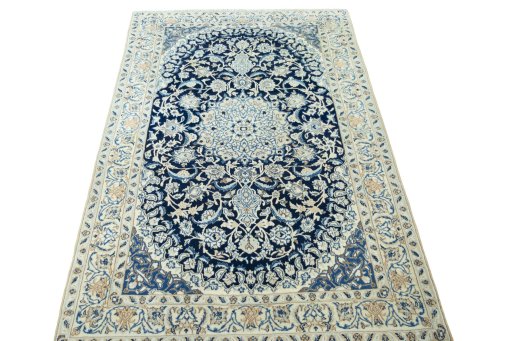 Surface texture of 2000s Nain rug with natural Wool and intricate pattern