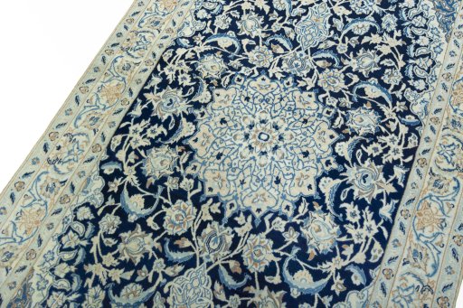Backside of handmade 2000s Nain rug showing knot structure and weave density