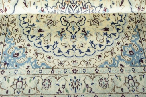 Corner detail of 2000s Nain rug showing border pattern and Wool pile