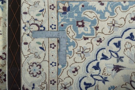 Surface texture of 2000s Nain rug with natural Wool and intricate pattern