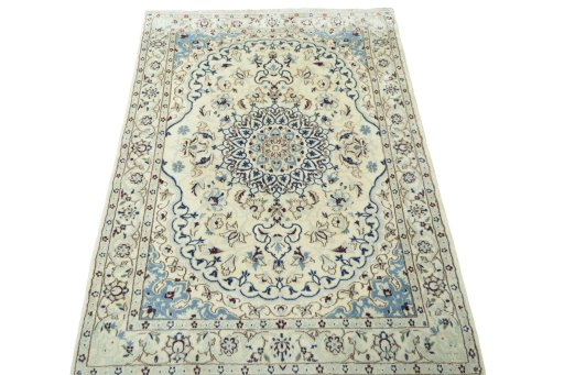 Surface texture of 2000s Nain rug with natural Wool and intricate pattern