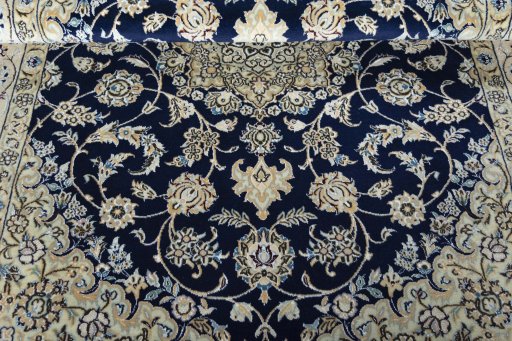 Corner detail of New Nain rug showing border pattern and Wool pile