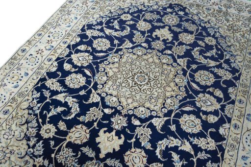 Backside of handmade New Nain rug showing knot structure and weave density