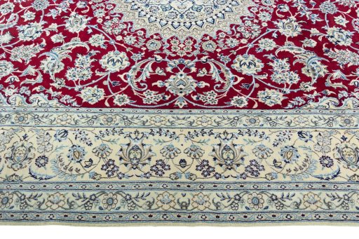 Corner detail of 2000s Nain rug showing border pattern and Wool pile