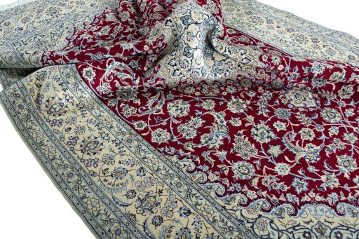 Surface texture of 2000s Nain rug with natural Wool and intricate pattern