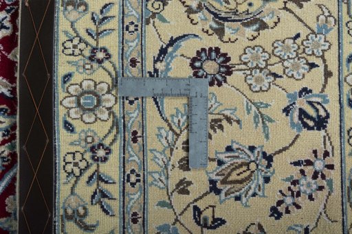 Backside of handmade 2000s Nain rug showing knot structure and weave density