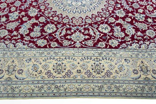 Corner detail of 2000s Nain rug showing border pattern and Wool pile