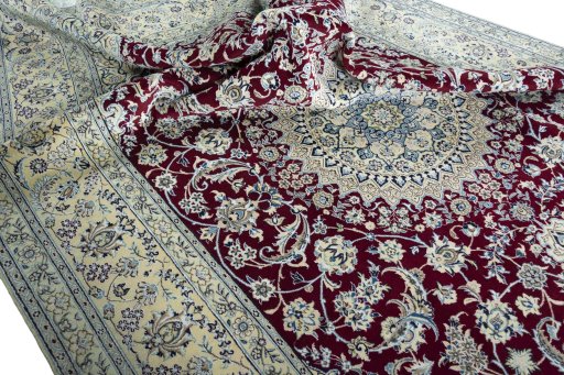 Surface texture of 2000s Nain rug with natural Wool and intricate pattern