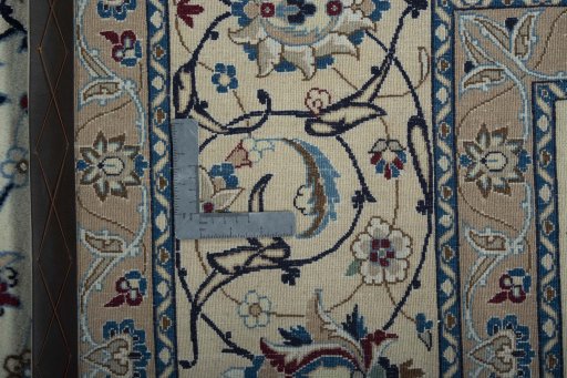 Backside of handmade New Nain rug showing knot structure and weave density
