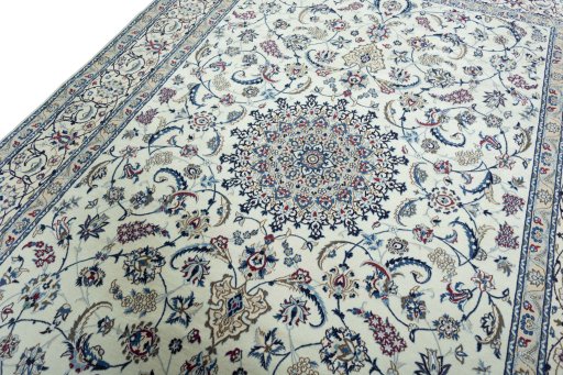Backside of handmade New Nain rug showing knot structure and weave density