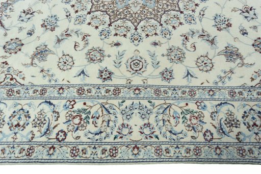 Corner detail of 2000s Nain rug showing border pattern and Wool pile