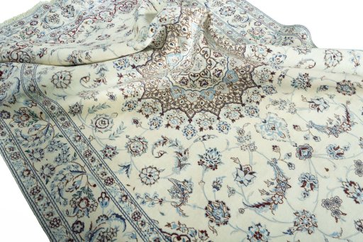 Surface texture of 2000s Nain rug with natural Wool and intricate pattern