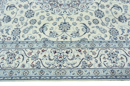 Corner detail of 2000s Nain rug showing border pattern and Wool pile