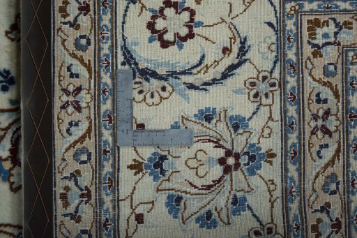 Backside of handmade New Nain rug showing knot structure and weave density